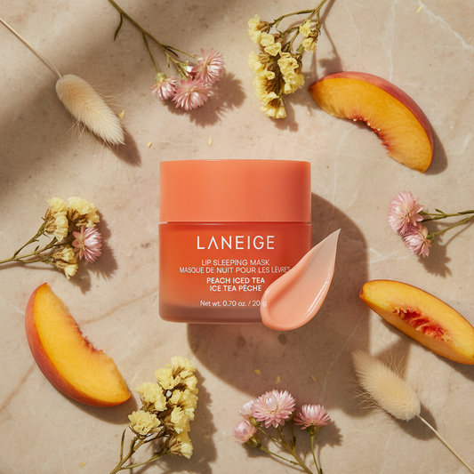 Laneige Lip Sleeping Mask Peach Iced Tea lifestyle flat lay with peach slices