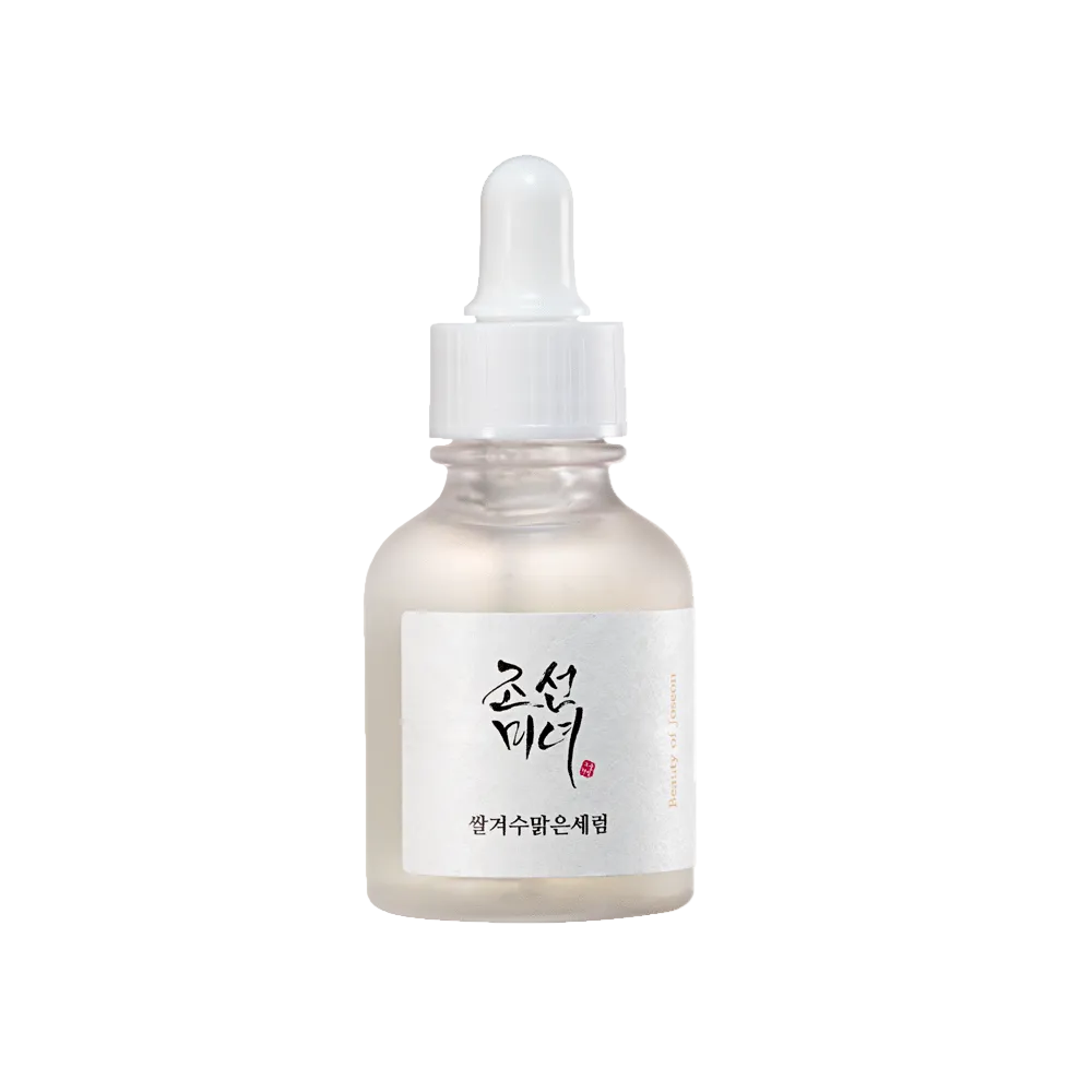 Beauty of Joseon Glow Deep Serum Rice Alpha-Arbutin lifestyle flat lay on white marble with rice grains and dried 
