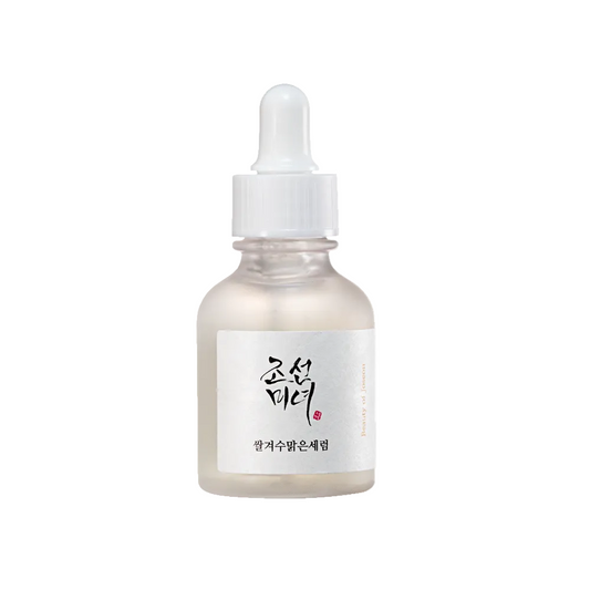 Beauty of Joseon Glow Deep Serum Rice Alpha-Arbutin lifestyle flat lay on white marble with rice grains and dried 
