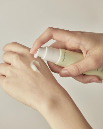 Beauty of Joseon Light On Serum Centella Vitamin C lifestyle flat lay on white marble with centella leaves and 